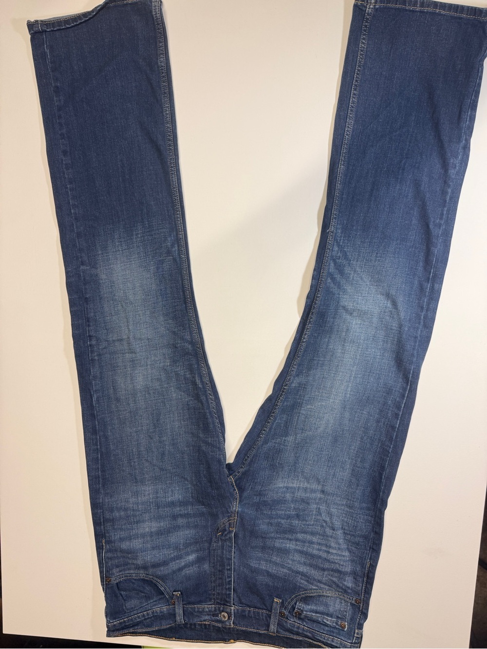 Levi's light blue denim jeans with gold stitching